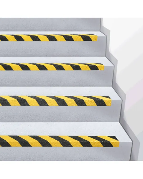 Hazard-stripe anti-slip nosings on concrete stairs
